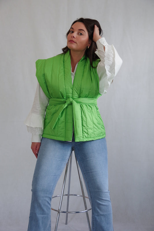 Green quilted bodywarmer with belt